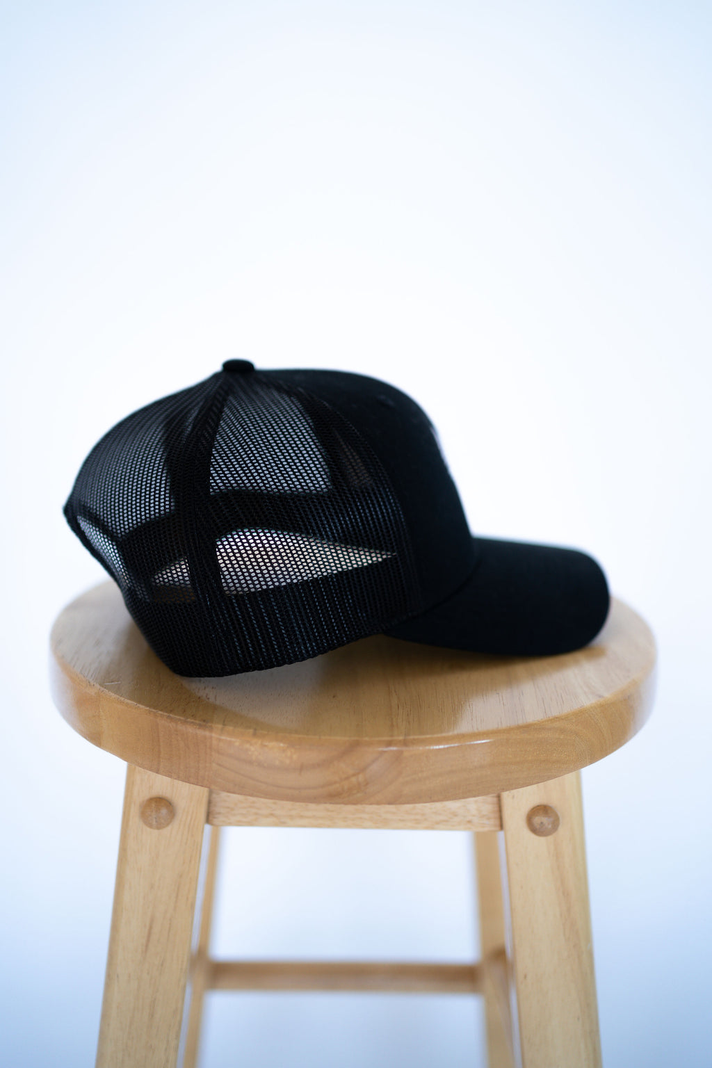 Black Trucker Style Hat with Dove Logo
